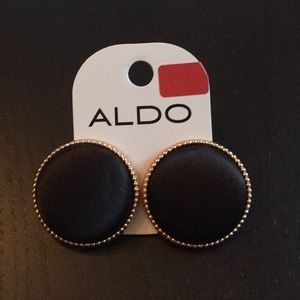 Large black studs with gold trim